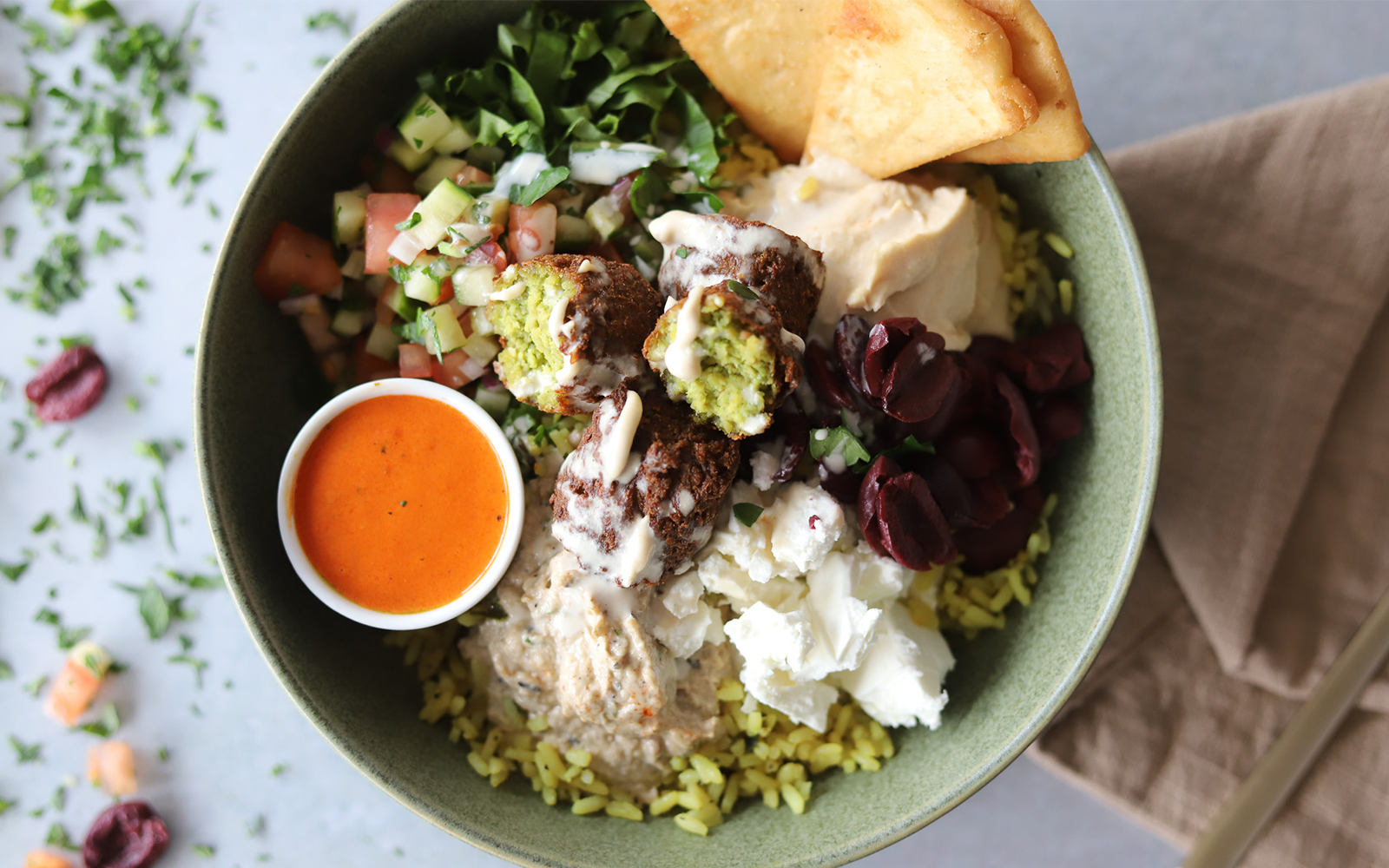 Chefs tasting recipes in an industrial kitchen.